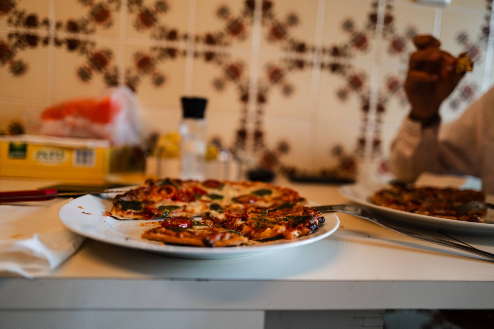 Eating pizza in dad's kitchen