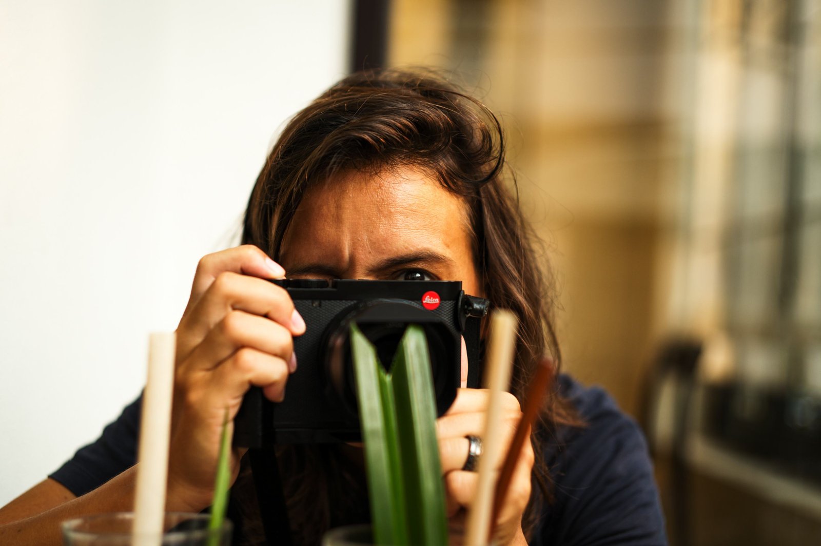Anne Catherine Nobre behind her Leica, eyes above the camera.